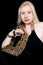 Portrait of girl with Boa constrictor snake. Woman holds snake in hands and posing in front of camera. Cold blooded reptile.