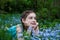 Portrait of   girl with forget-me-nots flowers