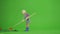 Portrait of girl in hat and rubber boots on chroma key green screen. Little cute girl gardener loosens the soil with big