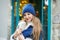 Portrait of a girl in a hat and scarf, a walk through the Christmas city, a smile on her face, cool weather, a fascinating look