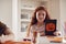 Portrait Of Girl At Home With Friends Having Fun Making Halloween Decorations Together