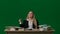 Portrait of girl on isolated background light bulbs hanging on top. Girl sitting at the desk thinking looks up finding