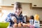 Portrait Of Girl In Kitchen Decorating Home Made Cupcakes