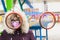 Portrait of a girl in a medical mask and glasses on a childrens sports playground.