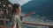 Portrait of girl on pier with breathtaking background, follow me moment. Woman pointing on inspiring landscape of nature