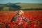 Portrait of a girl on the street with a wreath of poppy flowers on the head