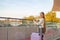 Portrait of a girl with a suitcase is waiting for travel and meeting