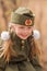 Portrait of a girl with two plaits and white bows in uniform on the Victory Day