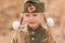 Portrait of a girl with two plaits and white bows in uniform on the Victory Day