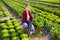 Portrait of girl vegetable grower in family vegetable farm