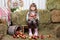 Portrait of girl villager with basket of apples