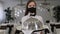 Portrait of a girl waitress in mask in a restaurant with tray covered with a lid