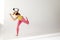 Portrait with girl wearing sportswear and VR glasses, training over white background. Virtual sport workout in motion