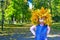 Portrait of a girl in a wreath of yellow leaves