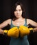 Portrait of a girl in yellow boxing gloves
