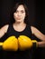Portrait of a girl in yellow boxing gloves