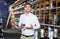 Portrait of glad male customer tasting wine before purchasing it