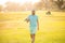 portrait of golfer in cap with golf club walk on green grass, golfing