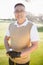 Portrait of golfer posing with a ball