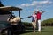 Portrait of golfers couple on golf course