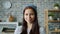 Portrait of good-looking young woman flirting smiling standing in apartment