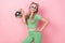 Portrait of good mood pretty girl dressed colorful suit in blue sunglass arm on waist hold discoball isolated on pink