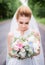 Portrait of a gorgeous bride with tender skin and deep blue eyes