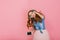 Portrait of gorgeous happy long-haired girl in headphones singing favorite song isolated on pink background. Attractive