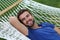 Portrait of a gorgeous man laying on a hammock