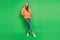 Portrait of gorgeous teenager stylish hipster lady posing wear hood on green background