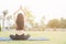 Portrait of gorgeous young woman practicing yoga in garden,Asian women meditating with yoga on a mat,Health fitness concept