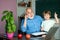 Portrait of grandfather and grandson on blackboard in classroom. Student and tutoring education concept. Teachers day