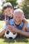 Portrait Of Grandfather And Grandson With Football