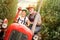 Portrait grandpa giving driving lesson to boy in tractor