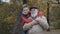 Portrait of grandson embraces grandfather