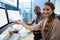 Portrait of graphic designer at desk with colleague