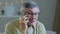 Portrait grey haired senior man in glasses talk on phone smiling elderly grandpa chatting cheerfully use mobile sharing