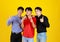 Portrait group of 3 adults asian handsome men are smiling and thumb fingers up look feel confident. Shooting in studio with