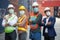 Portrait group of confident container worker wearing face mask and standing at warehouse logistic in Cargo freight ship for import