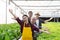 Portrait group diversity of vegetable farm workers waving hand welcome gesture