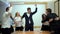 Portrait of a group of happy and diverse business young people. They jump in the air and cheer to celebrate their