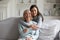 Portrait of grownup daughter embrace cuddle mature mom