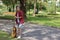 Portrait of guitarist relaxing against acoustic guitar in nature with copy space background.