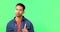 Portrait, hand gesture and no with a man on a green screen background in studio waving his finger. Stop, warning and
