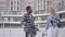 Portrait handsome African American man standing with bicycle against the background of urban architecture talking with