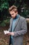 Portrait handsome bearded man, reading book and relaxing. Blurred background.Horizontl, film effect