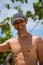 Portrait of a handsome happy man at tropical resort with smile