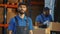 Portrait of Handsome Latin Male Worker Standing Outside of Warehouse Smiling, Looking at Camera