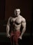 Portrait of handsome male bodybuilder isolated on black background