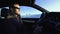 Portrait of handsome man in car in winter